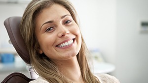 Happy relaxed woman in dental chair