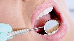 a patient receiving dental care from a dentist near Tyler